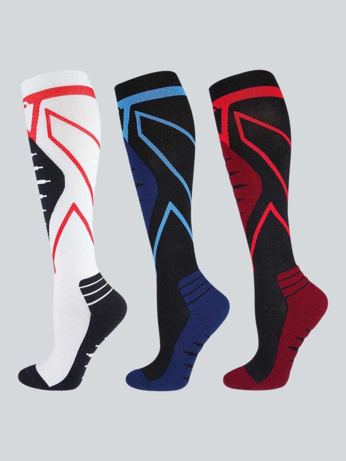 Kotyss knee-high athletic compression socks in white, black-blue, and black-red with seamless breathable design.