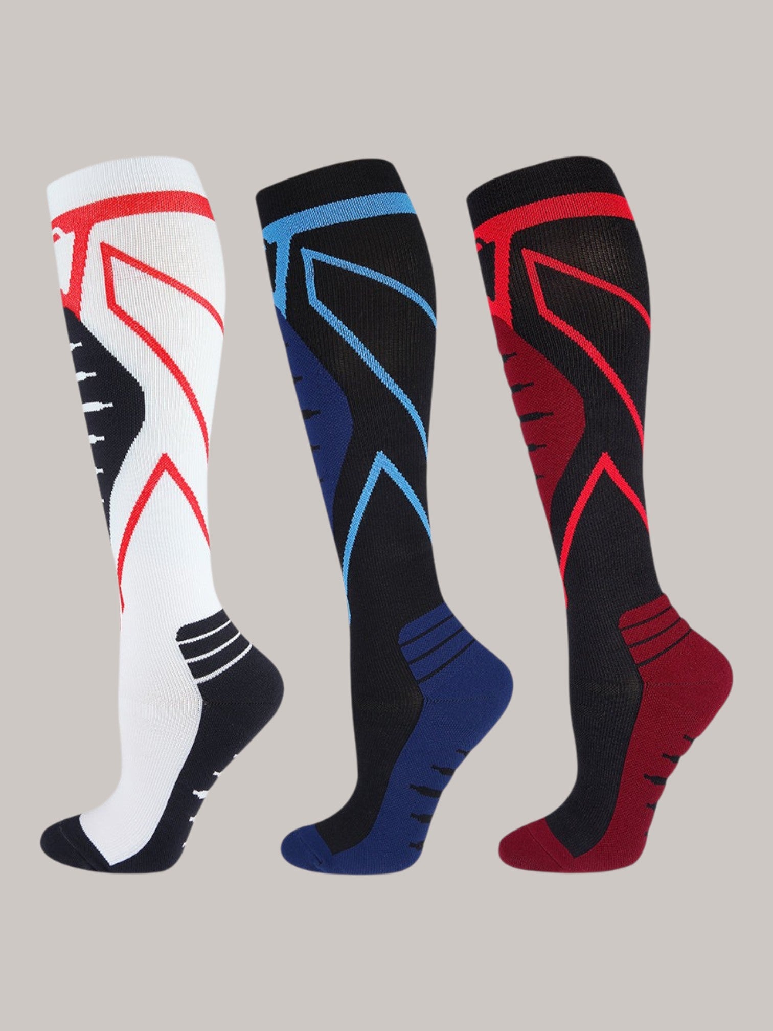Kotyss unisex knee-high compression socks in white, black, and red with seamless breathable athletic design.