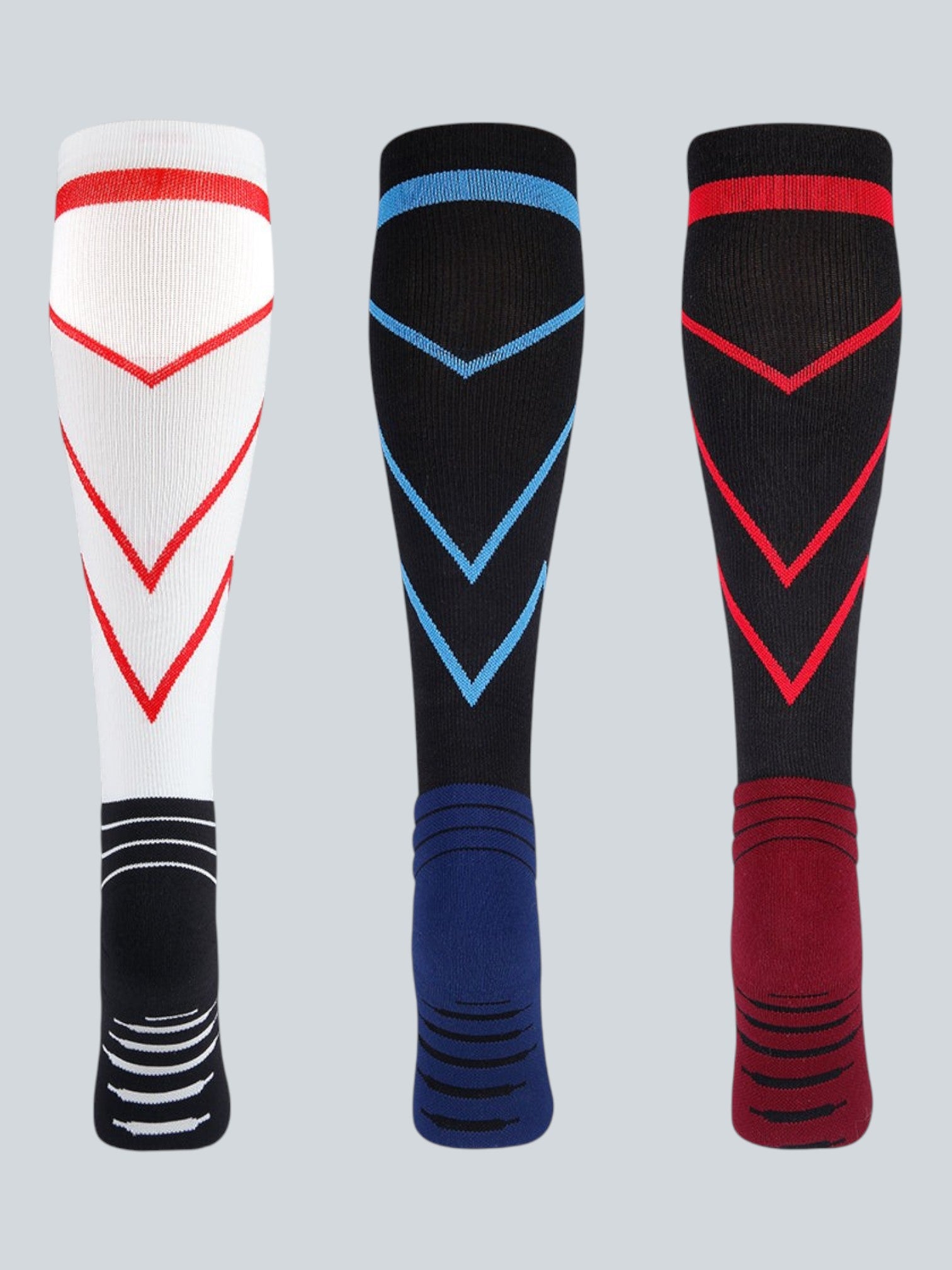 Kotyss knee-high compression socks in white, black, and red with chevron patterns and reinforced heel padding.