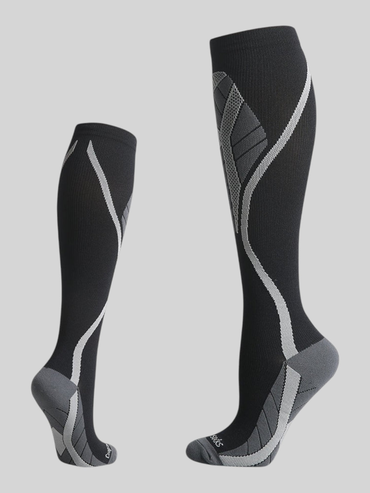 Kotyss black and grey knee-high compression socks with seamless breathable fabric and athletic support design.