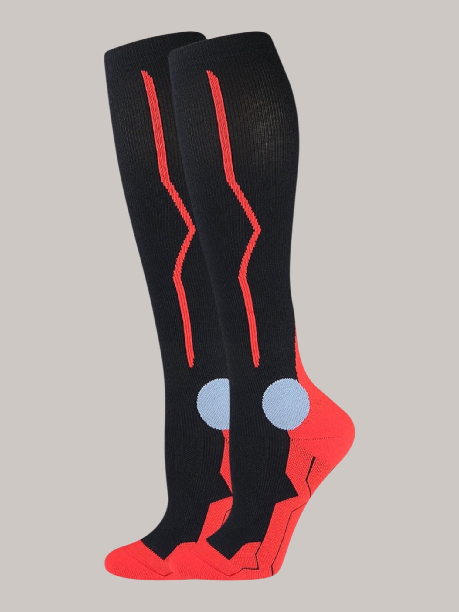 Kotyss black and red knee-high compression socks with seamless breathable fabric and padded toe and heel support.