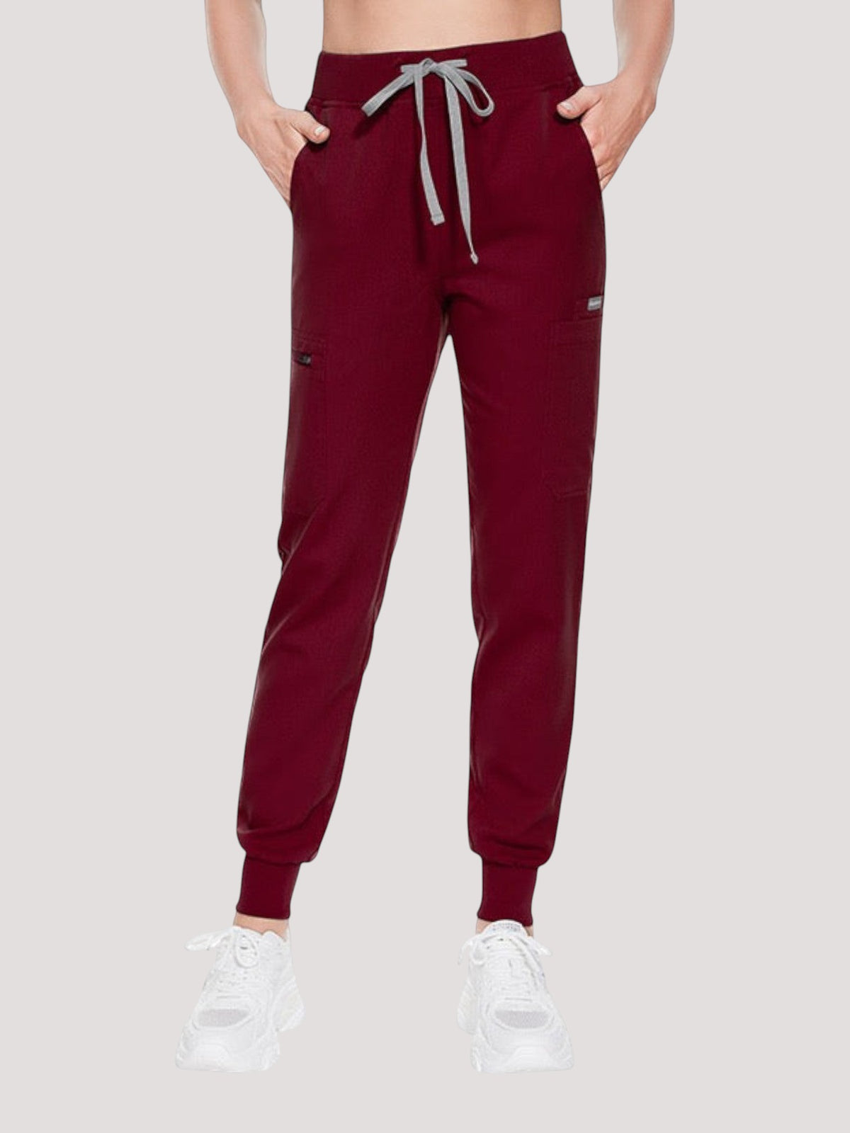Kotyss women's burgundy medical scrub jogger pants with multiple pockets and a drawstring waist