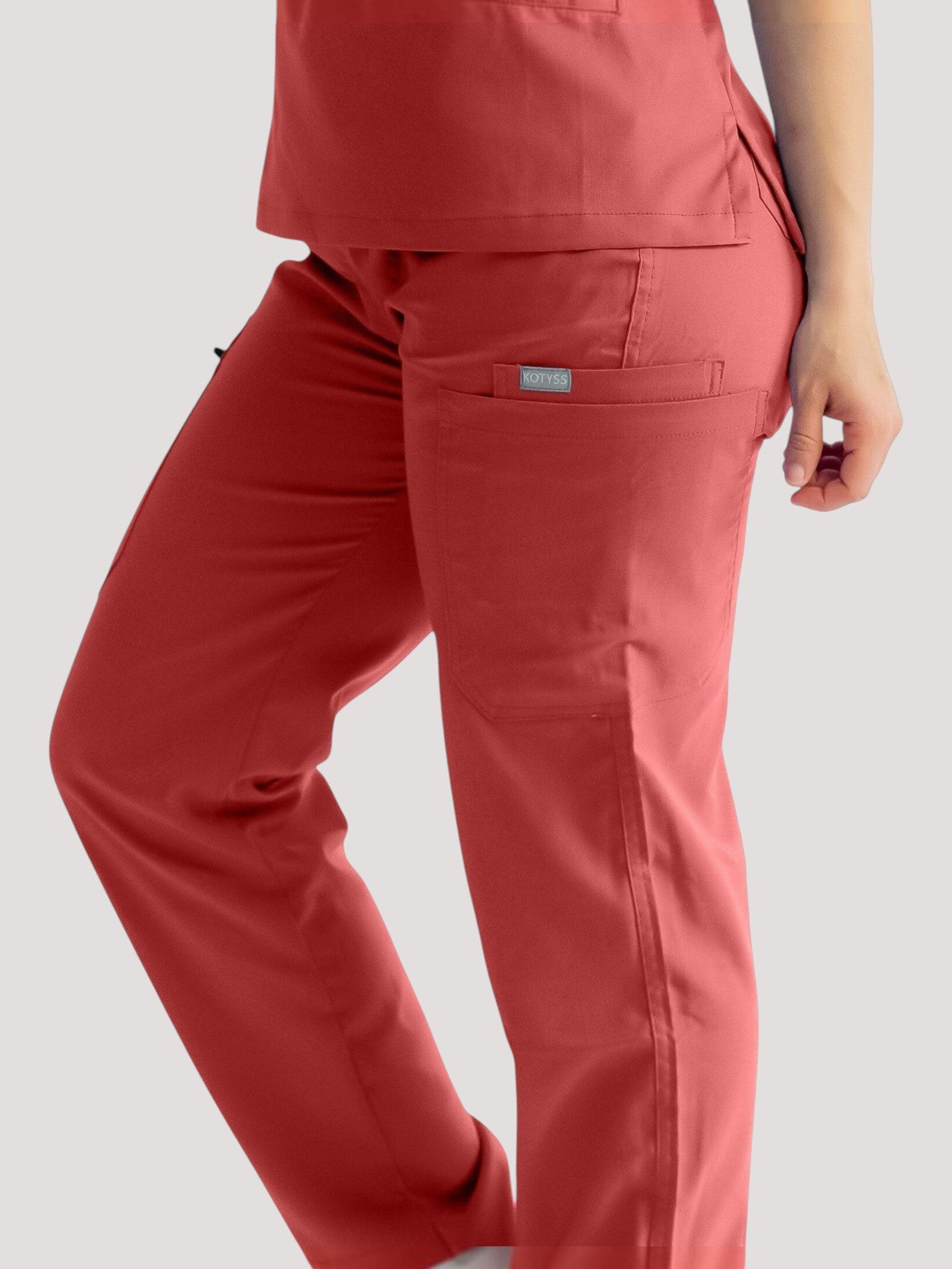 Kotyss straight cut medical scrub pants in red with multiple utility pockets and breathable 4-way stretch fabric