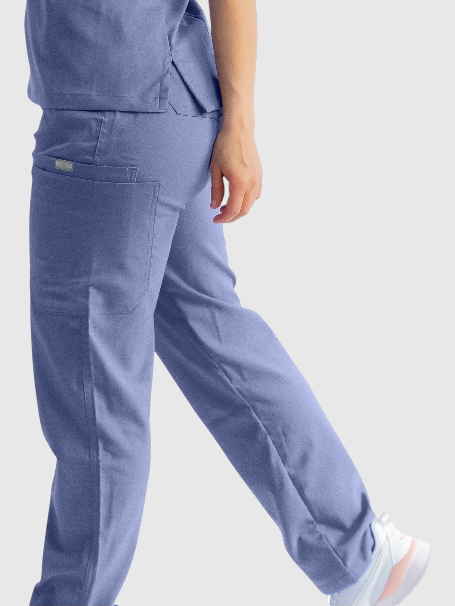 Kotyss straight cut medical scrub pants in periwinkle blue with multiple utility pockets and breathable fabric