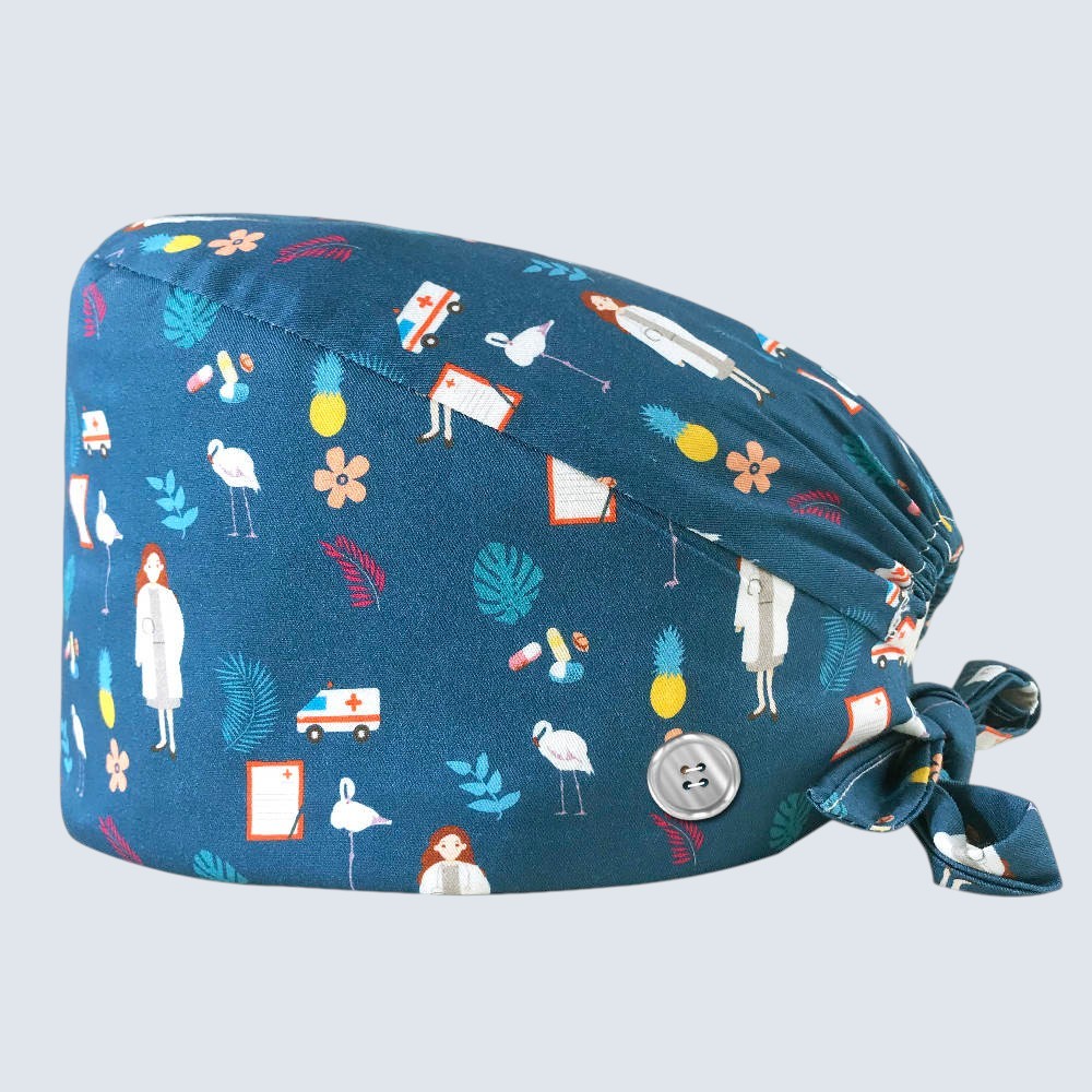Kotyss unisex scrub cap in teal with a medical-themed pattern, featuring adjustable tie straps and side buttons.