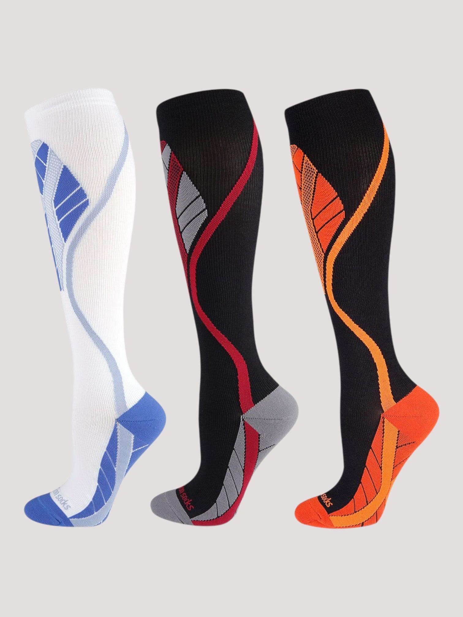 Kotyss performance athletic knee high compression socks in white, black-red, and black-orange with seamless design.