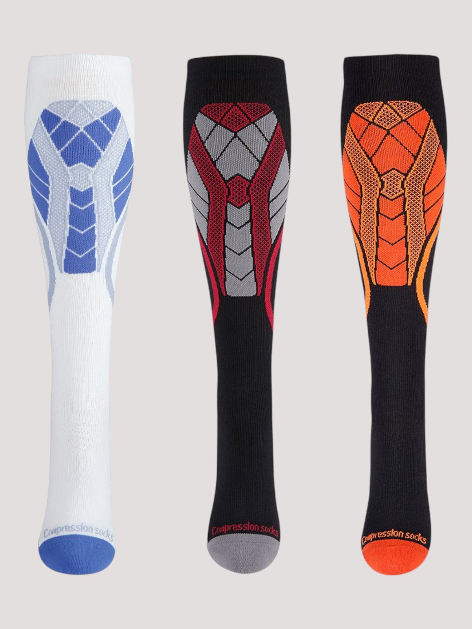 Three pairs of Kotyss knee high compression socks in white, black and red, and black and orange with padded zones.