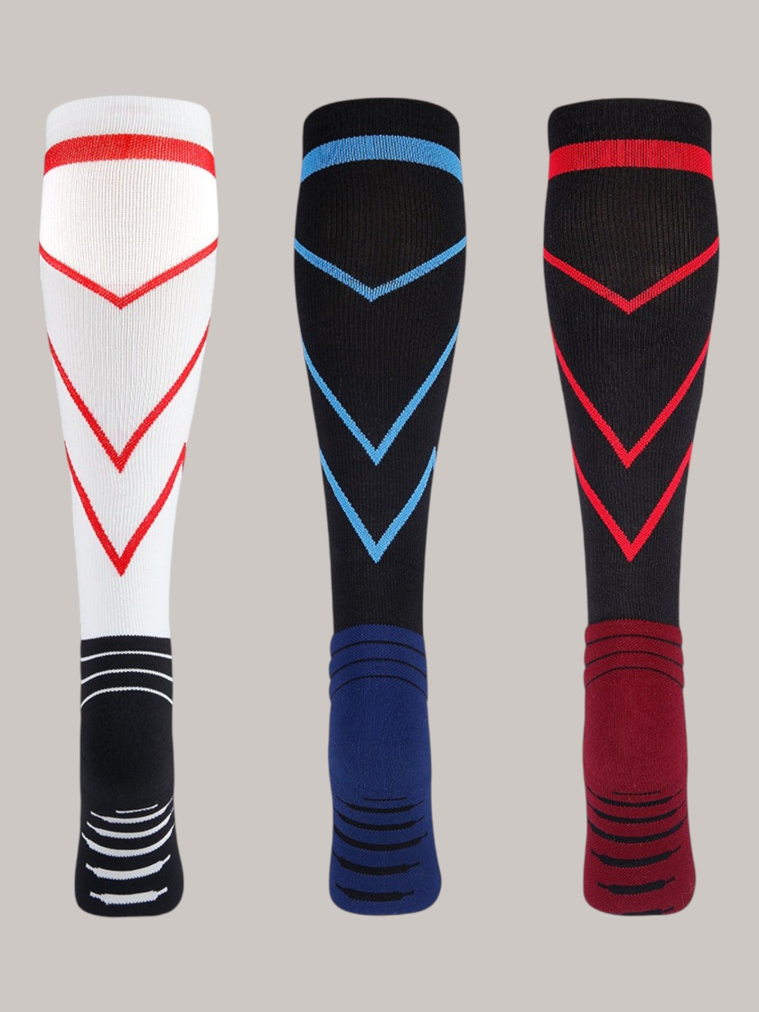 Kotyss performance athletic compression knee high socks in white, black, and red with chevron patterns and padding.