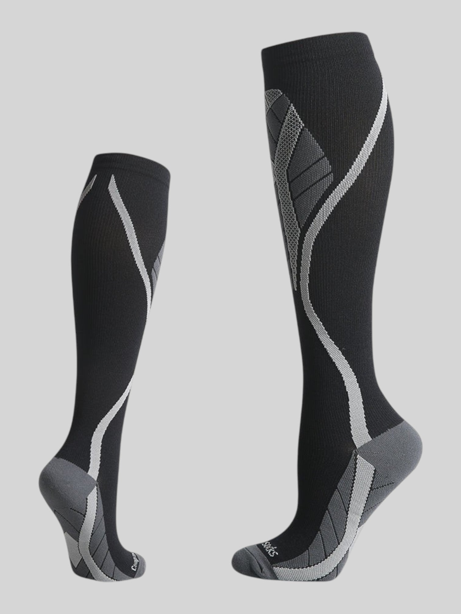 Kotyss black and grey knee-high compression socks with seamless breathable fabric and athletic support design.