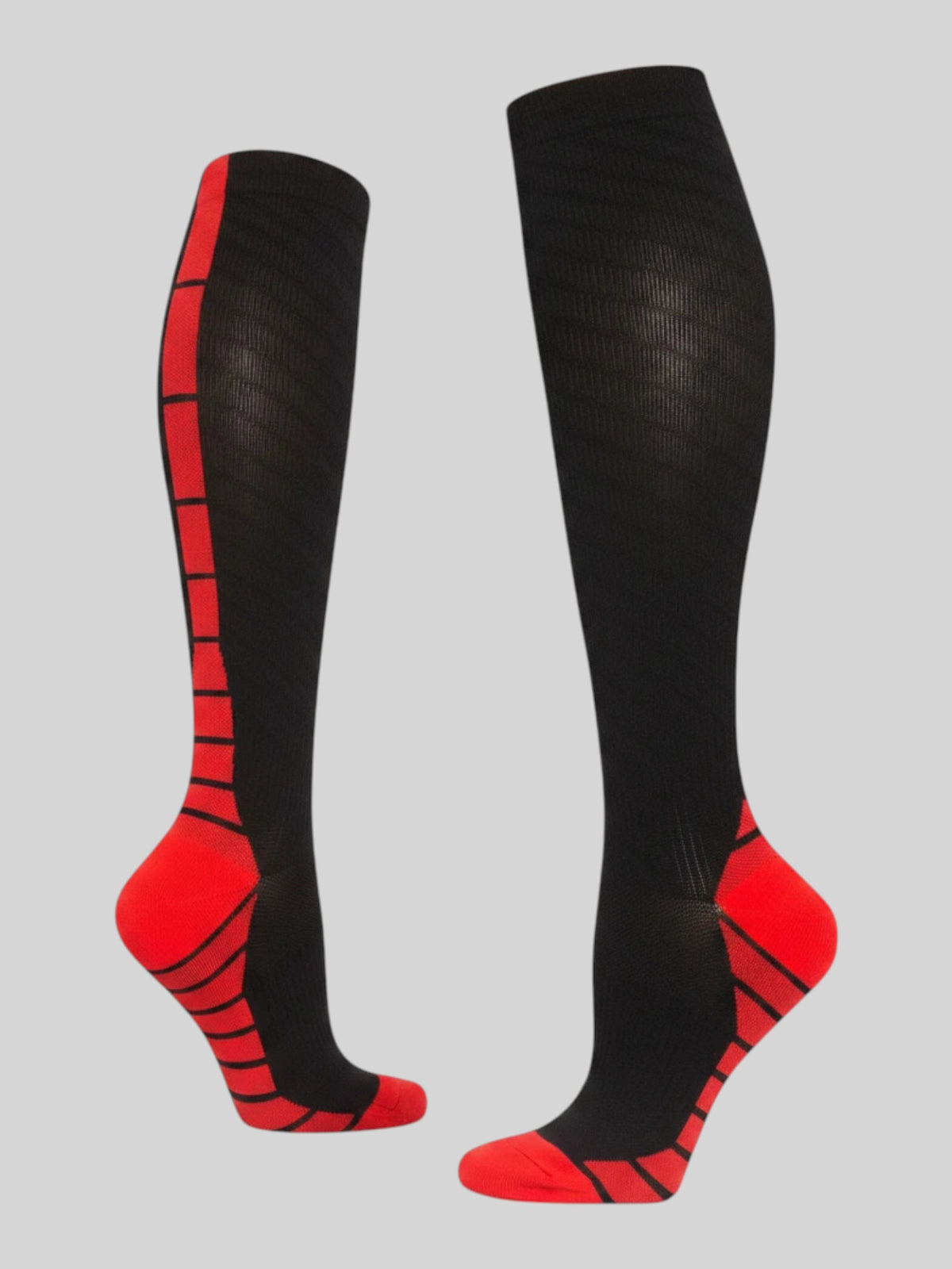 Kotyss black and red knee-high athletic compression socks with seamless breathable fabric and padded support zones.