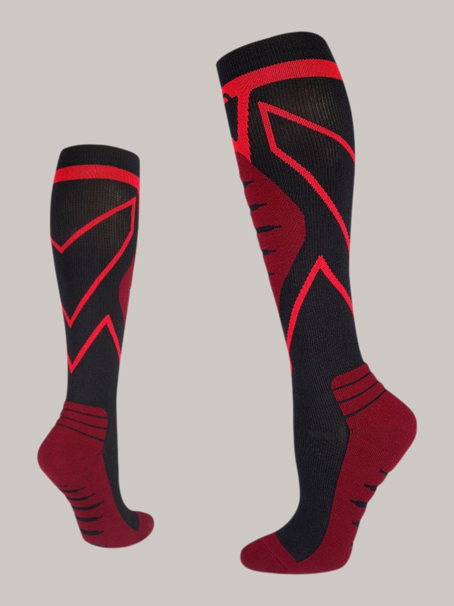 Kotyss knee-high athletic compression socks in black and red with seamless, breathable, and supportive padding.