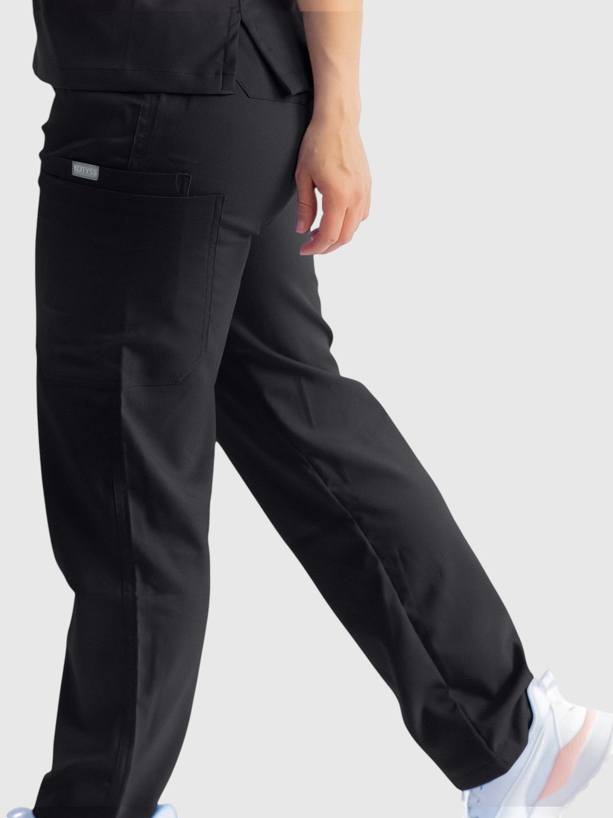 Kotyss black straight cut medical scrub pants with multiple utility pockets and breathable 4-way stretch fabric