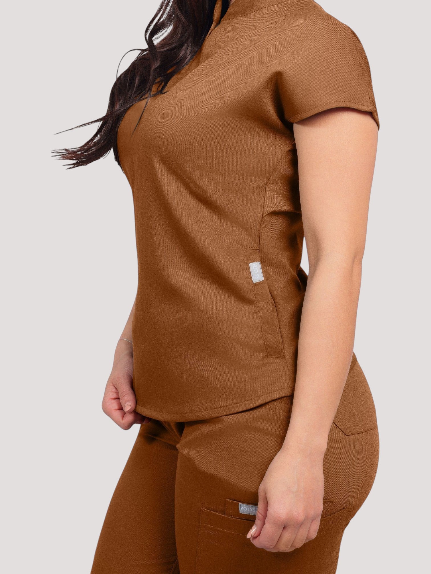 Kotyss women's brown collared scrub top and jogger set in breathable, anti-microbial 4-way stretch fabric.