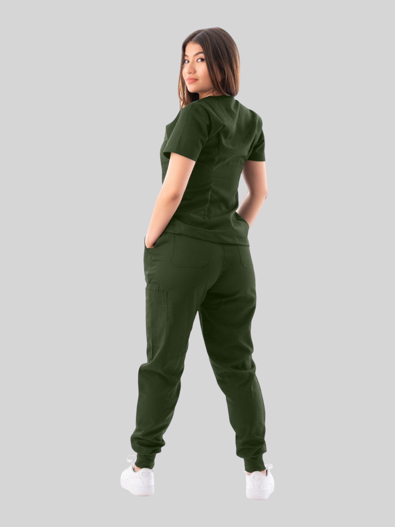Kotyss dark green women's medical scrub set with V-neck top and multi-pocket jogger pants, back view.