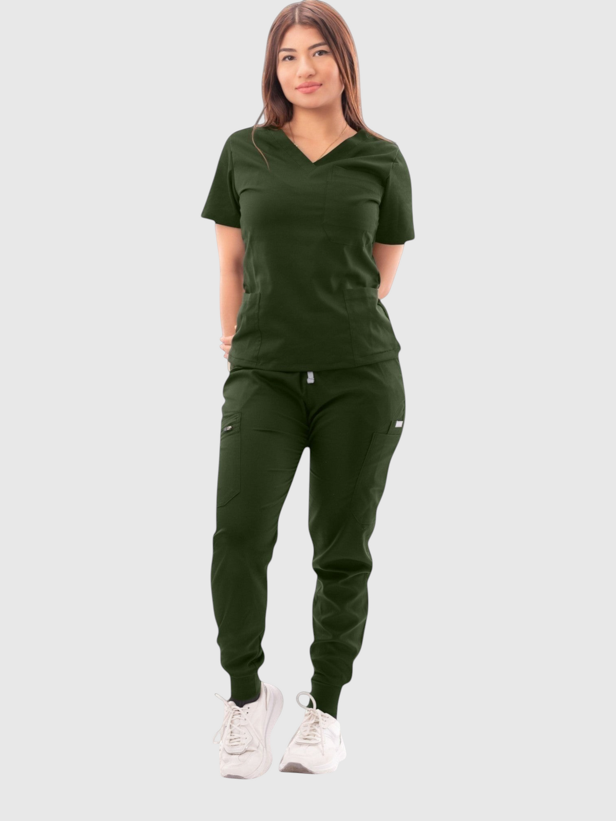 Model wearing a dark green Kotyss V-neck scrub top and multi-pocket jogger pants set for medical professionals.