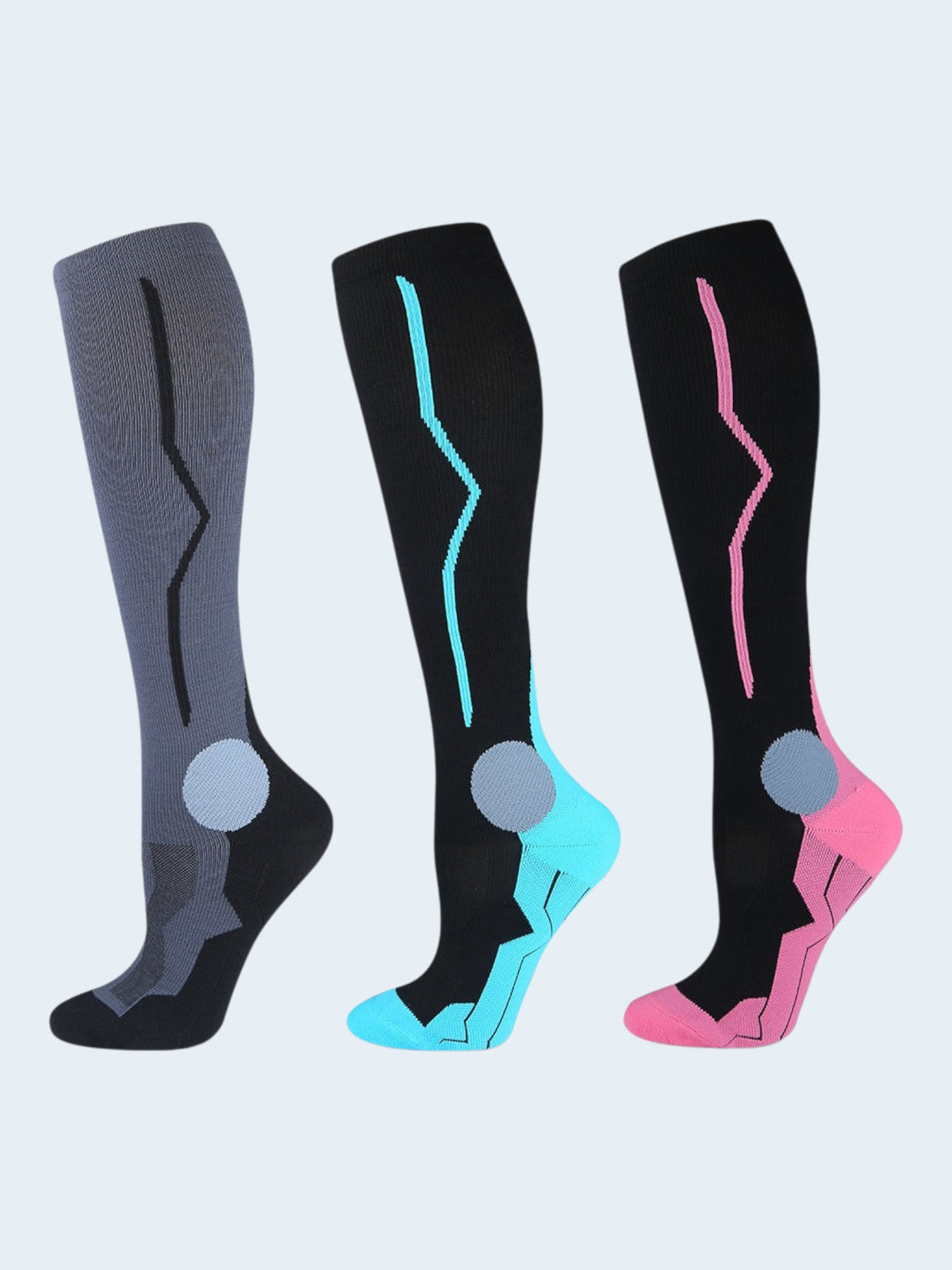 Kotyss knee high compression socks in grey, black with blue, and black with pink, featuring seamless design.