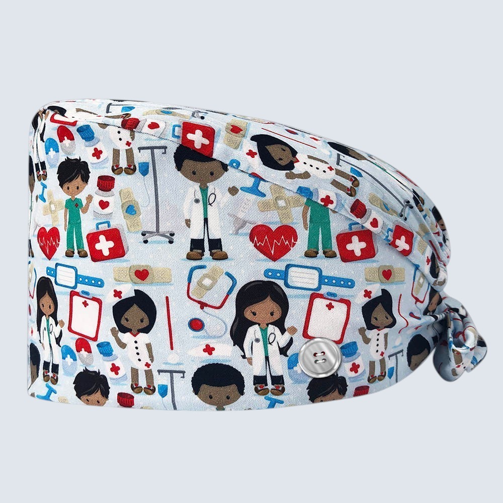 Kotyss unisex scrub cap in light blue with a medical-themed pattern of doctors, hearts, and bandages with side buttons.