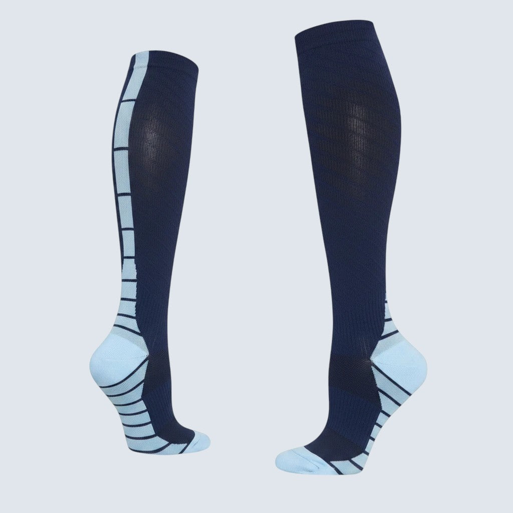 Kotyss navy and light blue seamless knee high compression socks with athletic padding for support and breathability.