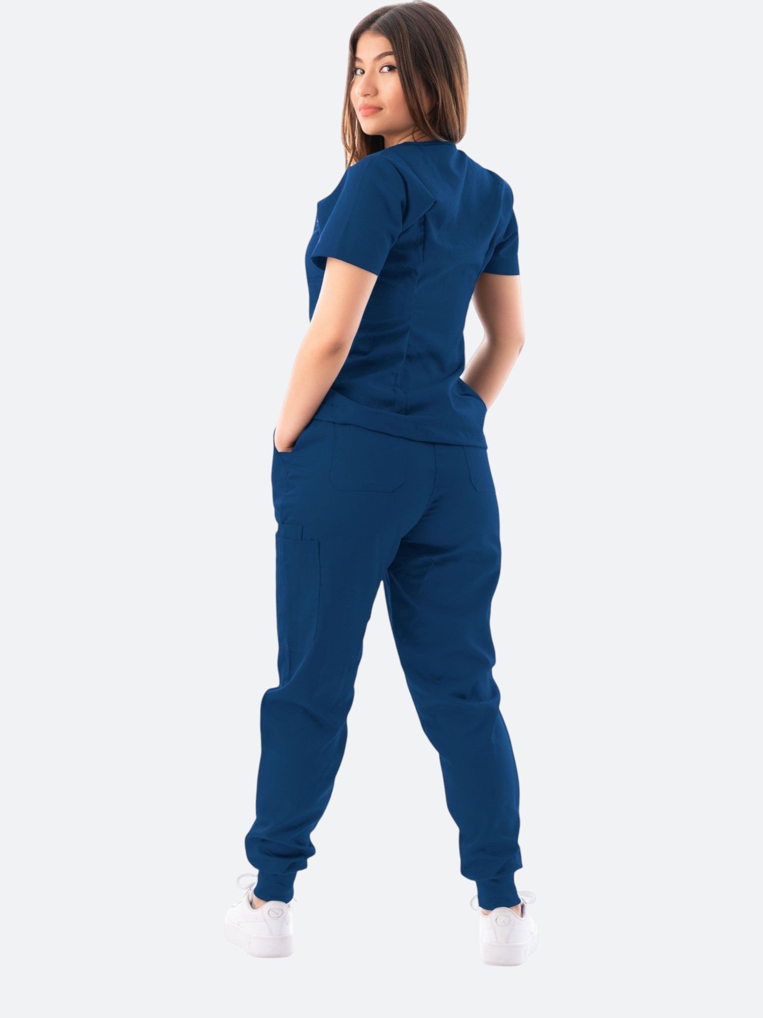Kotyss women's navy blue V-neck scrub top and jogger pants set with multiple pockets on a model, back view
