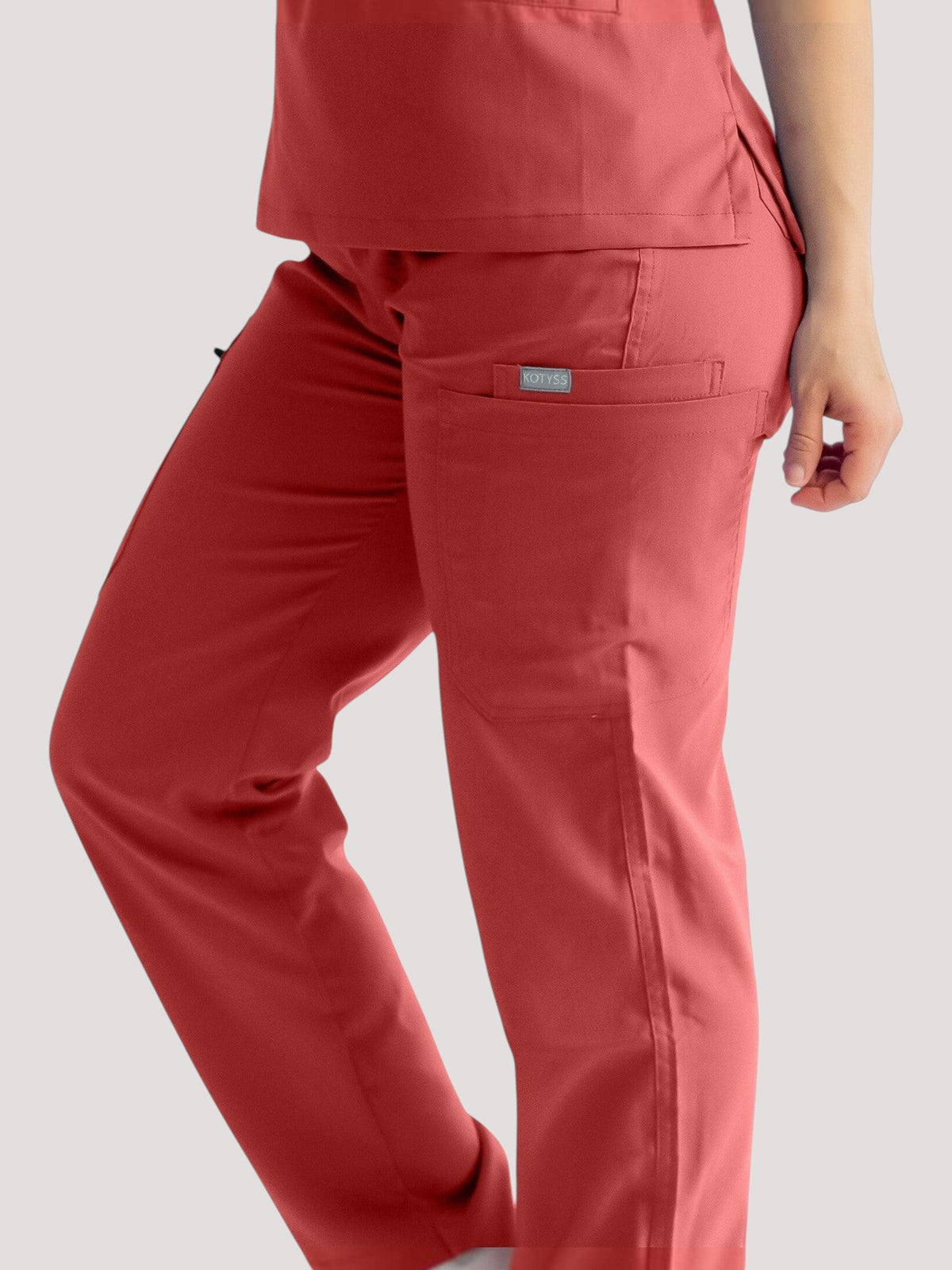 Kotyss straight cut medical scrub pants in red with multiple utility pockets and breathable 4-way stretch fabric