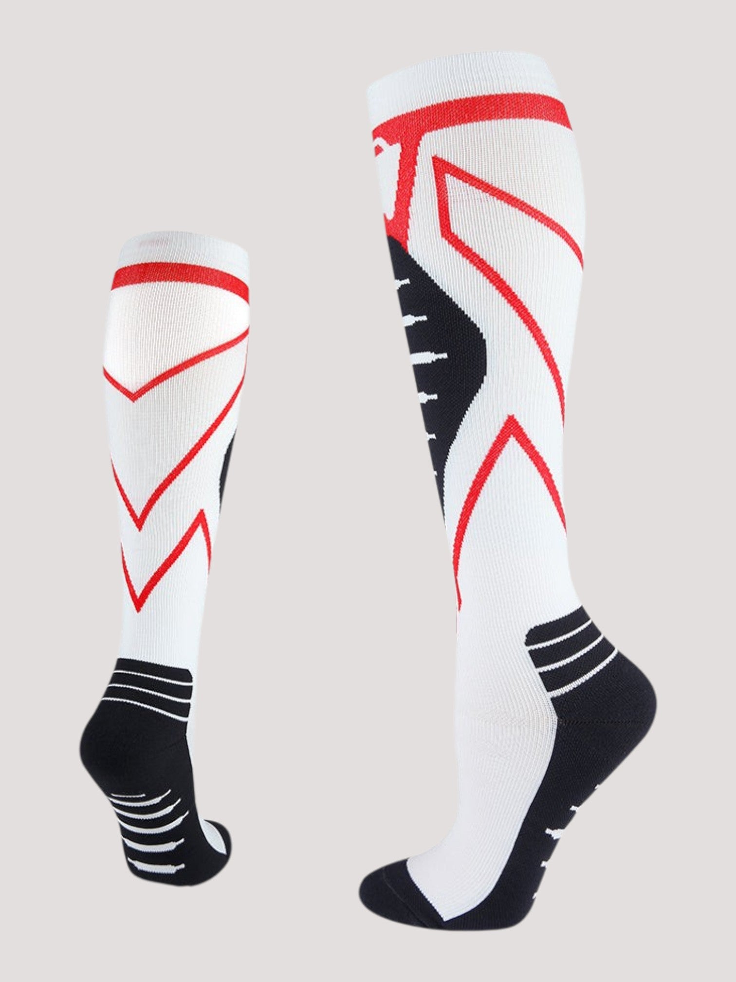 Kotyss knee-high compression socks in white with red geometric accents and black heel and toe padding.