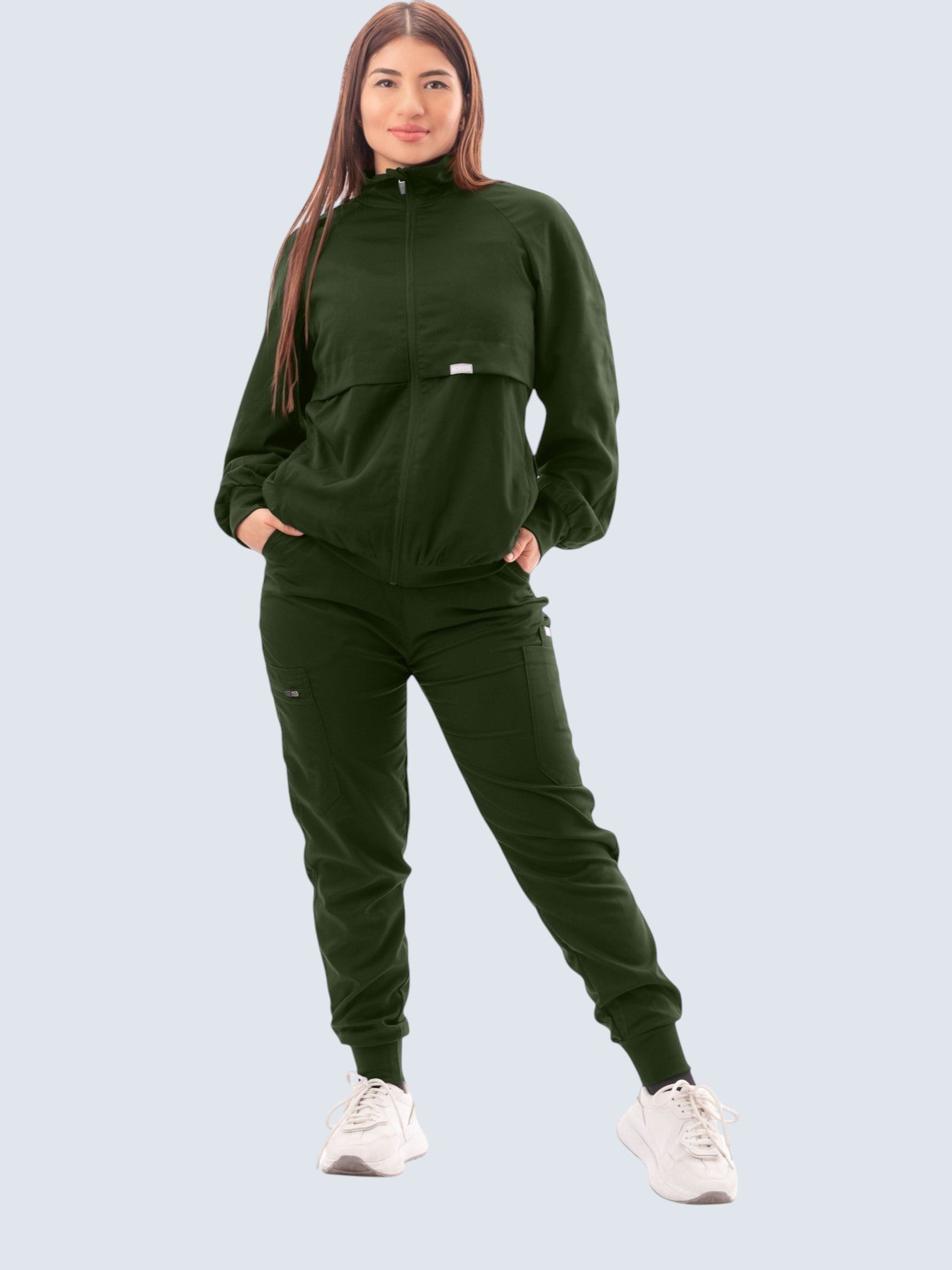 Kotyss women's dark green scrub jacket and matching joggers set with a high neck and functional pockets